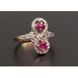 UNUSUAL RUBY AND DIAMOND RING the round cut rubies totaling approximately 0.35cts, within multi