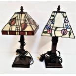 PAIR OF TIFFANY STYLE LAMPS with square section opaque shades, raised on square stepped bases,