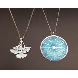 TWO NORMAN GRANT SILVER AND ENAMEL DECORATED PENDANTS one a Ginkgo pendant with pastel shades of
