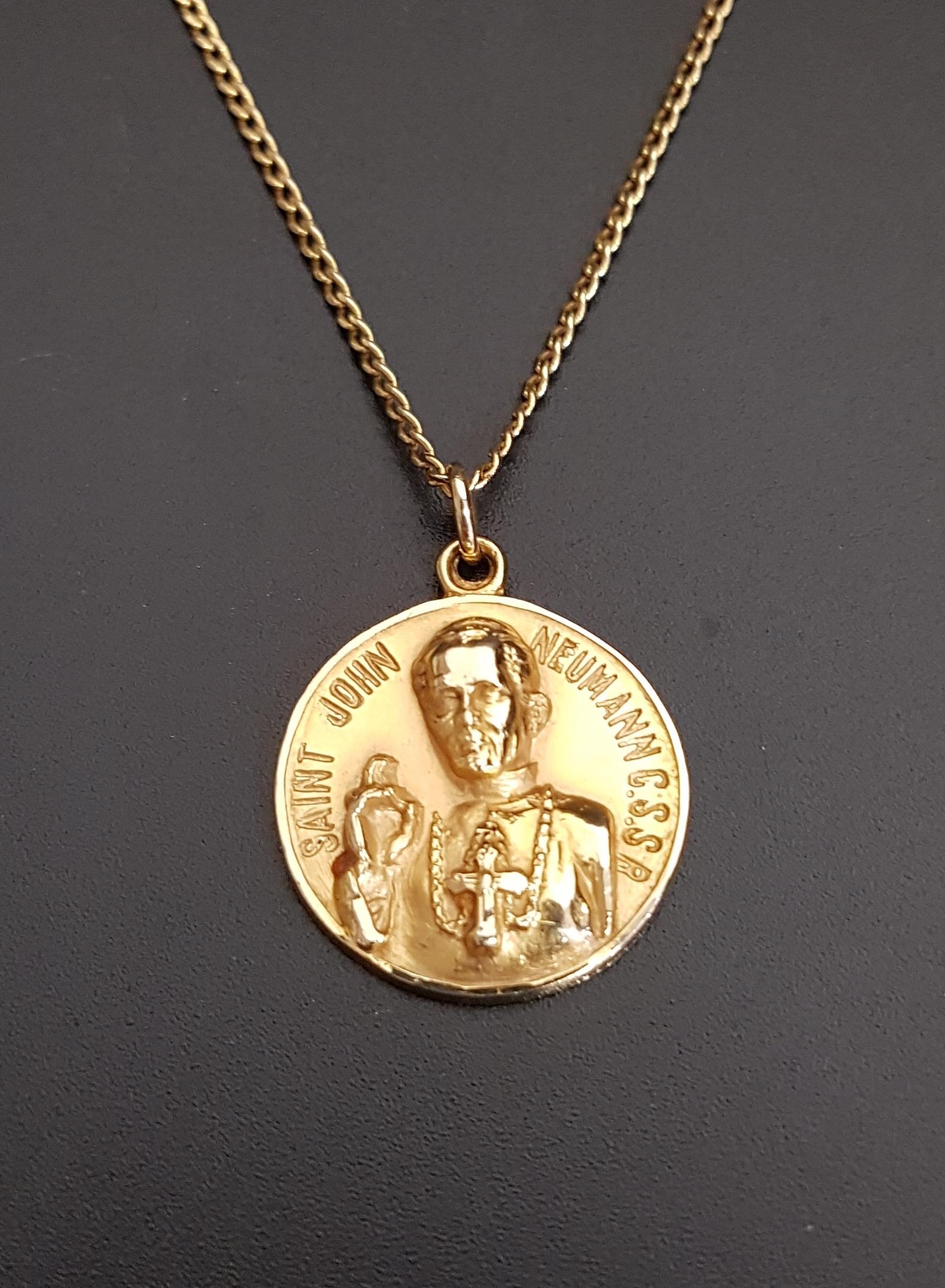 FOURTEEN CARAT GOLD RELIGIOUS PENDANT with relief decoration of Saint John Neumann C.S.S.R (