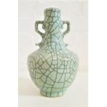 CHINESE SONG GE TYPE VASE with shaped side handles, in a pale green oppaque crackle glaze, the