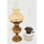 VERITAS OIL LAMP with a circular glass reservoir and brass wick holder with a glass stack, 40cm