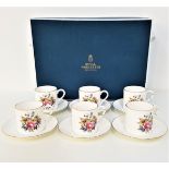 ROYAL WORCESTER BOXED COFFEE SET comprising six cups and saucers, decorated with flowers and gilt