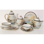 JAPANESE EGG SHELL PORCELAIN TEA SET decorated with flowers and birds, comprising six cups and