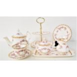 ROYAL ALBERT TEA SERVICE in the Dimity Rose pattern, comprising eight cups, six saucers, tea pot,