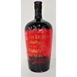 LARGE VINTAGE FRENCH WINE BOTTLE overpainted in red, the neck wrapped in wire, the body marked in