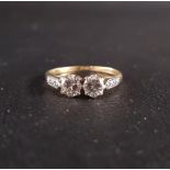 DIAMOND TWO STONE RING the round brilliant cut diamonds totaling approximately 0.7cts, flanked by