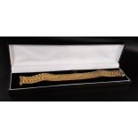 ATTRACTIVE NINE CARAT GOLD BRACELET formed with two rows of double curb links, each link with both