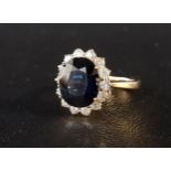 IMPRESSIVE SAPPHIRE AND DIAMOND CLUSTER DRESS RING the central oval cut sapphire approximately 4.
