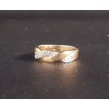 DIAMOND SET NINE CARAT GOLD RING of entwined design, ring size K-L and approximately 2.8 grams