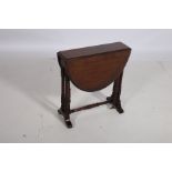 AN EDWARDIAN MAHOGANY SUTHERLAND TABLE the oval hinged top raised on dual ring turned supports and