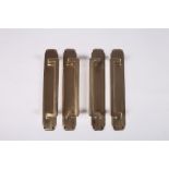 A SET OF FOUR BRONZE ART DECO DESIGN DOOR HANDLES each of rectangular form with stepped back