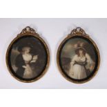 A PAIR OF 19TH CENTURY COLOURED ENGRAVINGS study of females ovals a pair in foliate moulded frames