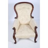 A 19TH CENTURY MAHOGANY AND UPHOLSTERED ARMCHAIR the moulded top rail above a button upholstered