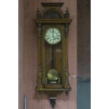 A GOOD 19TH CENTURY WALNUT CASE VIENNA CLOCK the shell carved and moulded pediment above a glazed