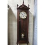 A MAHOGANY CASE VIENNA WALL CLOCK the brass and enamel dial with Roman numerals within a glazed