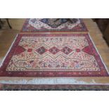 A PERSIAN HANDMADE WOOL RUG