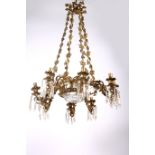A FINE 19TH CENTURY BRASS AND CUT GLASS EIGHT BRANCH CHANDELIER with pierced foliate circlet issuing