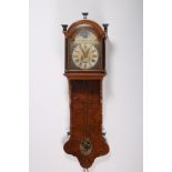 A WALNUT AND EBONISED DROP TRUNK CLOCK the rectangular arched hood containing a painted dial with