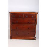 A VICTORIAN MAHOGANY CHEST of two short and three long graduated drawers on bun feet 128cm (h) x
