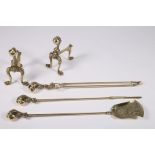 A SET OF THREE BRASS FIRE IRONS with claw and ball handles together with a pair of fire dogs en-