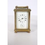 A BRASS CARRIAGE CLOCK with enamel dial and Roman numerals 14cm (h) x 8cm (w) x 7cm (d)