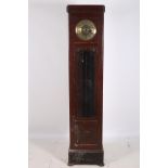 A CIRCA 1950s OAK LONG CASE CLOCK the rectangular case with bevelled glass panels with brass dial on