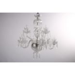 A CAVAN CUT GLASS EIGHT BRANCH CHANDELIER hung in two registers with scroll arms and drip pans