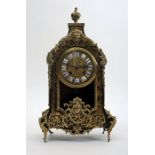 A Beaux Arts, French, brass-inlaid, ebonised, mantle clock.