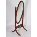 A MAHOGANY AND SATINWOOD INLAID CHEVAL MIRROR the oval plate within a moulded frame raised on a