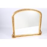 A VICTORIAN DESIGN GILTWOOD AND GESSO OVERMANTLE MIRROR the rectangular arched plate within a