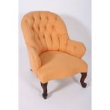 A 19TH CENTURY MAHOGANY AND UPHOLSTERED TUB SHAPED CHAIR with deep button upholstered back and