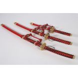 THREE JAPANESE SWORDS in sheaths graduated sizes 103cm 80cm 55cm