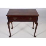 AN IRISH GEORGIAN MAHOGANY TABLE of rectangular outline with frieze drawer on cabriole legs with pad