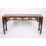 A GOOD CHINESE HARDWOOD CONSOLE TABLE of rectangular outline with pierced carved frieze on square