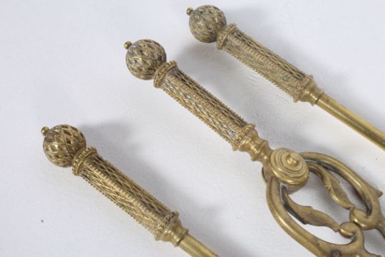 A SET OF THREE 19TH CENTURY BRASS FIRE IRONS - Image 2 of 2