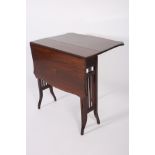 AN EDWARDIAN MAHOGANY SUTHERLAND TABLE the rectangular shaped top on splayed legs with castors