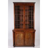 A GEORGIAN MAHOGANY LIBRARY BOOKCASE the roped cornice above a pair of astragal glazed doors