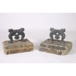 A PAIR OF 19TH CENTURY CAST IRON AND GRANITE FREE STANDING FOOT SCRAPES
