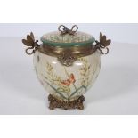 AN ART DECO DESIGN PORCELAIN AND GILT BRONZE MOUNTED LIDDED POT of bulbous tapering form with