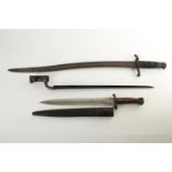A collection of three bayonets comprising, a Brown Bess socket bayonet, variously marked to the