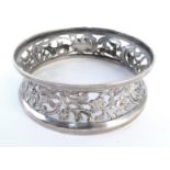 Irish silver miniature dish ring, of typical waisted form, pierced and repousse decorated with