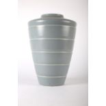 Keith Murray for Wedgwood, a ceramic vase, the body flaring to the shoulder with horizontal ribbing,