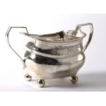 A George III Irish silver bright-cut sugar bowl by Richard Sawyer, the oblong waisted body on ball