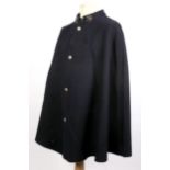 1930s Garda Síochána night cape, with blackened metal shamrock collar clasp and white metal buttons.