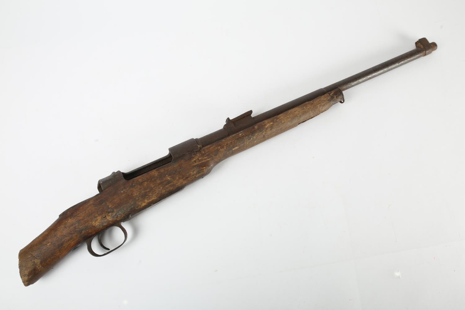 A 1914 -1918 German Mauser carbine rifle, the stock cut down and lacking bolt, in relic condition,