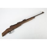 A 1914 -1918 German Mauser carbine rifle, the stock cut down and lacking bolt, in relic condition,