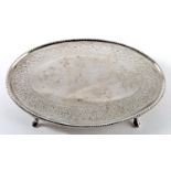 A Victorian, Irish silver, oval, bright-cut teapot stand, by John Smith, retailed by West, on