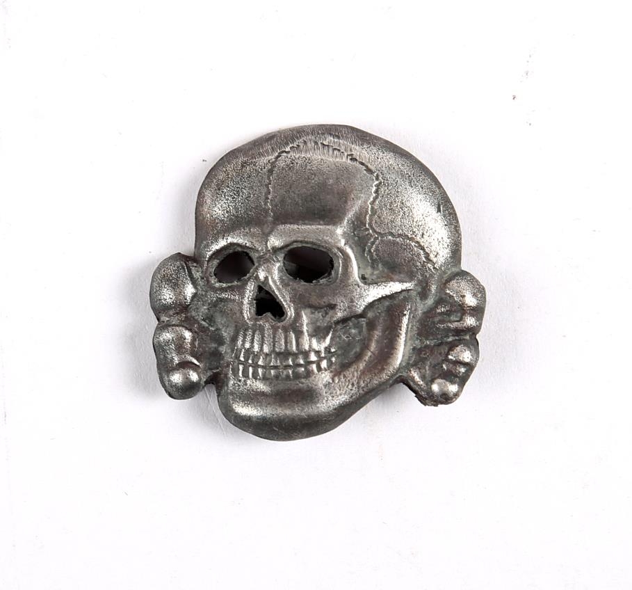 1934 to 1945 German death's head badge. The second version of the SS-Totenkopf the reverse marked "