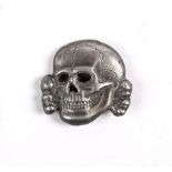 1934 to 1945 German death's head badge. The second version of the SS-Totenkopf the reverse marked "